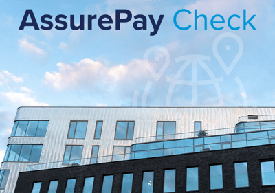 شعار AssurePay Check الموضوع فوق أحد المباني التعليمية